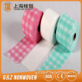 Nonwoven tissue rolls, baby wipe tissue roll